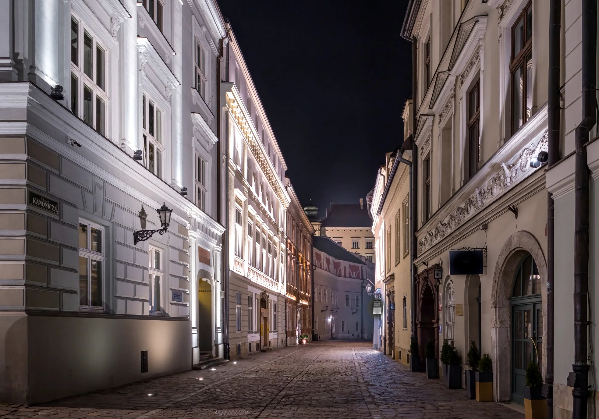 Kraków — historic tenement buildings at night